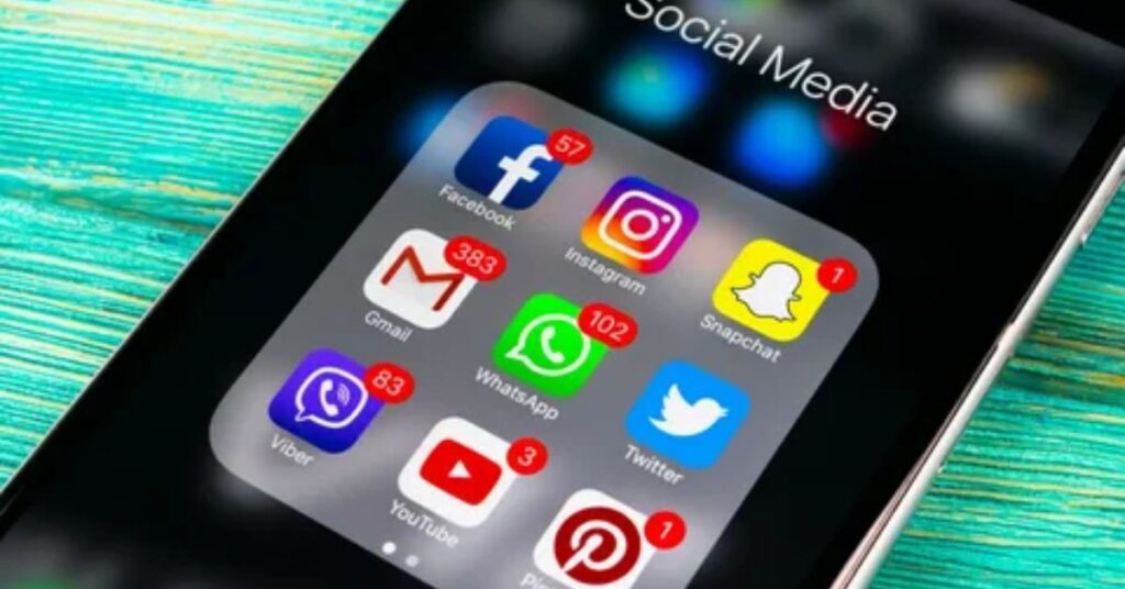 Small business using smartphone for social media marketing posts in 2025