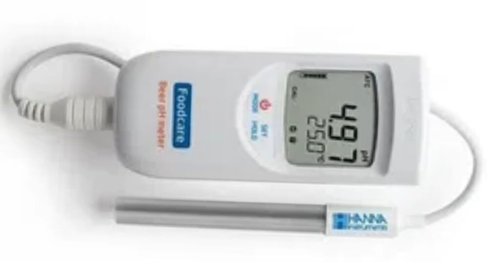 Digital pH tester measuring milk spoilage levels