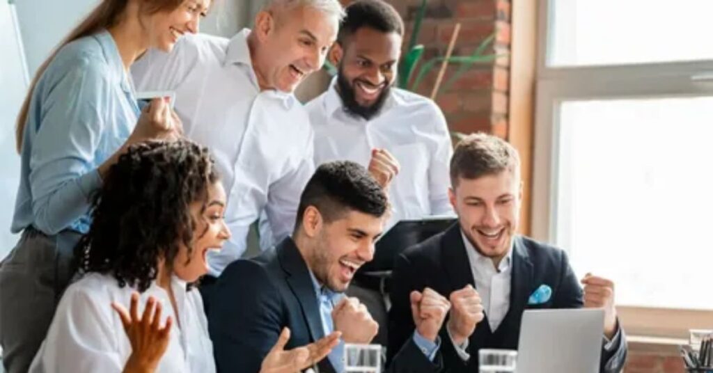 Entrepreneur celebrating brand growth with the best brand management tool